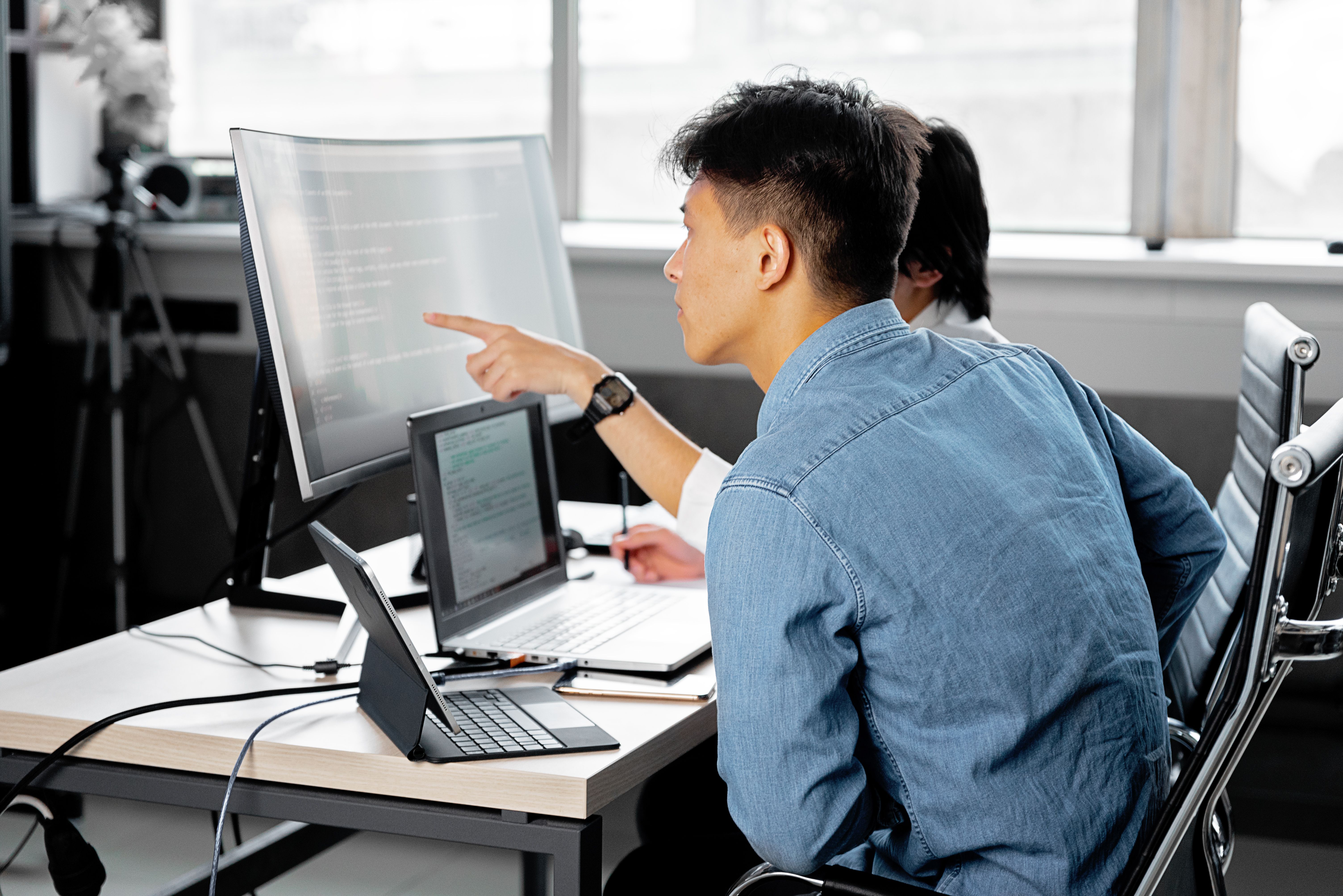 Developer building a digital product at a workstation